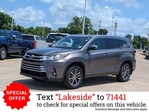 2019 Toyota Highlander XLE in Predawn Gray Mica — front three-quarter view